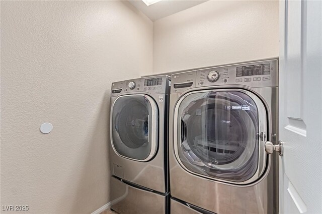 10584 Peach Creek St, Las Vegas, NV 89179 - laundry room with separate washer and dryer and a textured wall