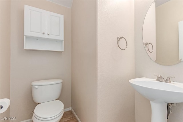 10584 Peach Creek St, Las Vegas, NV 89179 - half bathroom featuring toilet and baseboards