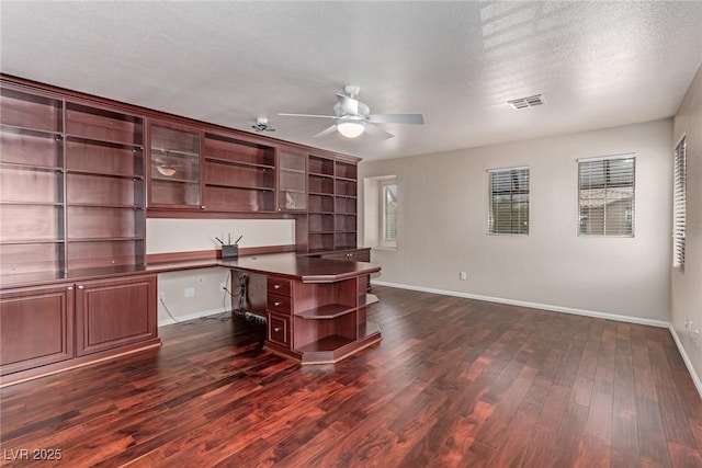 10584 Peach Creek St, Las Vegas, NV 89179 - unfurnished office with built in study area, ceiling fan, dark wood finished floors, and a textured ceiling
