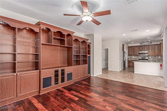 10584 Peach Creek St, Las Vegas, NV 89179 - unfurnished living room with a ceiling fan, wood finished floors, and recessed lighting