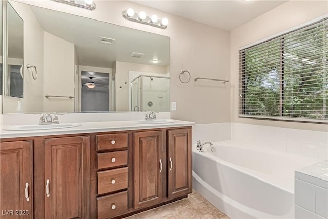 10584 Peach Creek St, Las Vegas, NV 89179 - bathroom with a stall shower, a bath, double vanity, ceiling fan, and tile patterned flooring