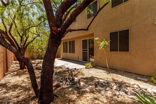 10584 Peach Creek St, Las Vegas, NV 89179 - back of property featuring stucco siding and a patio