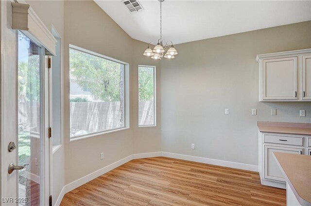 10198 Timber Willow Ave, Las Vegas, NV 89135 - unfurnished dining area featuring a chandelier and light wood-type flooring