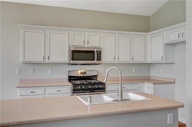 10198 Timber Willow Ave, Las Vegas, NV 89135 - kitchen featuring appliances with stainless steel finishes, white cabinetry, and light countertops