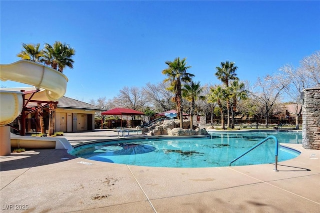 10198 Timber Willow Ave, Las Vegas, NV 89135 - community pool with a patio