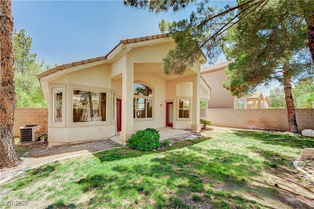 10198 Timber Willow Ave, Las Vegas, NV 89135 - rear view of house with stucco siding and a patio area