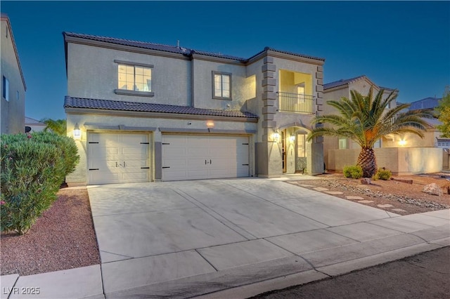1717 Jake Andrew Ave, North Las Vegas, NV 89086 - mediterranean / spanish home with a balcony, a tile roof, an attached garage, and stucco siding