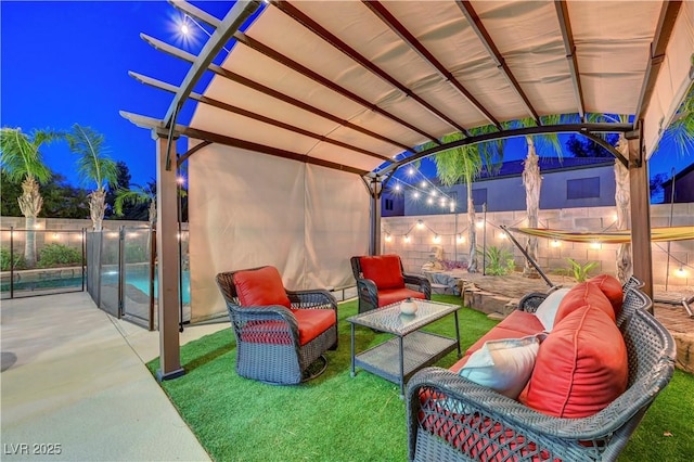 1717 Jake Andrew Ave, North Las Vegas, NV 89086 - patio at night with an outdoor living space and a patio area