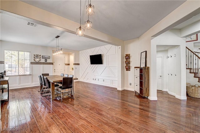 1717 Jake Andrew Ave, North Las Vegas, NV 89086 - dining space featuring stairs and dark wood-style flooring