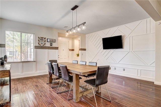 1717 Jake Andrew Ave, North Las Vegas, NV 89086 - dining space featuring a decorative wall and wood-type flooring