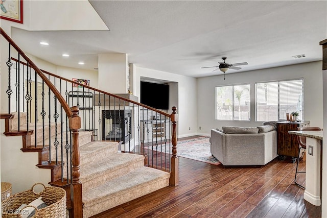 1717 Jake Andrew Ave, North Las Vegas, NV 89086 - living room with ceiling fan, dark wood-style flooring, stairway, and recessed lighting