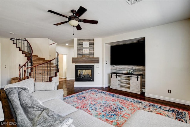 1717 Jake Andrew Ave, North Las Vegas, NV 89086 - living room featuring a multi sided fireplace, a ceiling fan, wood finished floors, stairway, and recessed lighting