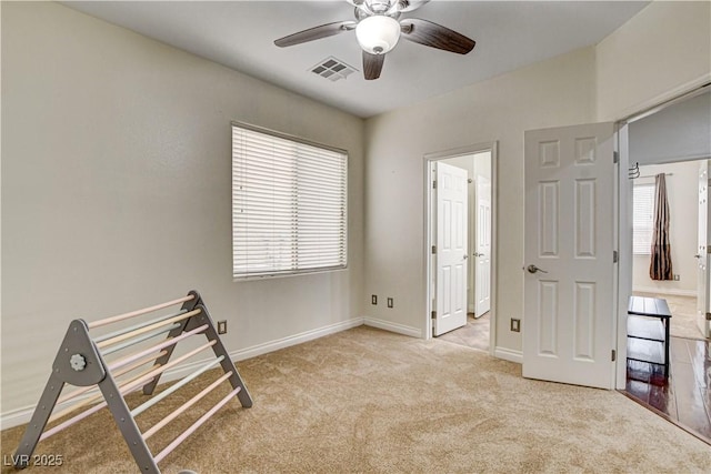 1717 Jake Andrew Ave, North Las Vegas, NV 89086 - unfurnished bedroom featuring carpet, multiple windows, and ceiling fan