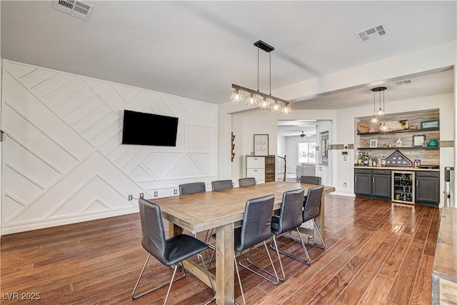1717 Jake Andrew Ave, North Las Vegas, NV 89086 - dining room with a dry bar, wood finished floors, and a ceiling fan