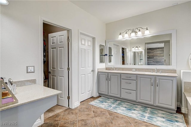 1717 Jake Andrew Ave, North Las Vegas, NV 89086 - bathroom with double vanity, tile patterned floors, and a closet