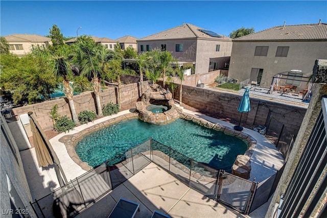 1717 Jake Andrew Ave, North Las Vegas, NV 89086 - view of swimming pool with a fenced backyard, a residential view, a patio, and a pool with connected hot tub