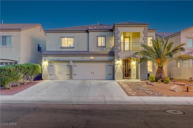 1717 Jake Andrew Ave, North Las Vegas, NV 89086 - mediterranean / spanish home featuring a balcony, a garage, stucco siding, concrete driveway, and a tile roof