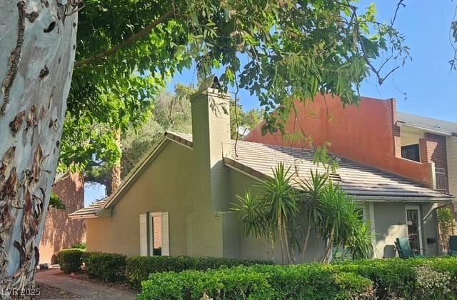 632 Tam O Shanter, Las Vegas, NV 89109 - view of property exterior featuring a chimney and stucco siding