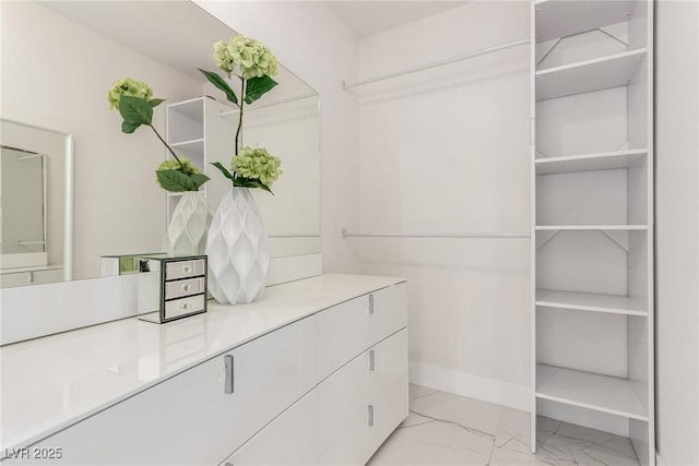 3826 Edmond St, Las Vegas, NV 89103 - walk in closet with light marble finish floors