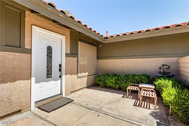 3826 Edmond St, Las Vegas, NV 89103 - property entrance featuring stucco siding and a patio