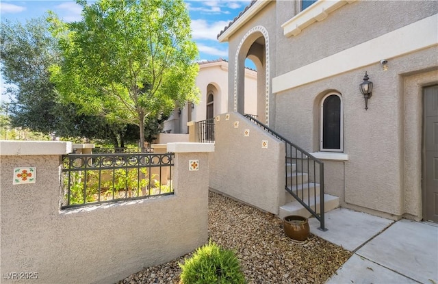 11901 Luna Del Mar Ln, Las Vegas, NV 89138 - property entrance with stucco siding and a surveillance system
