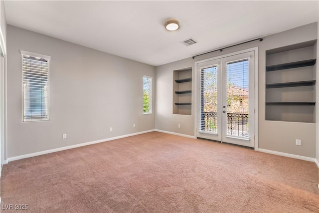 11901 Luna Del Mar Ln, Las Vegas, NV 89138 - spare room with carpet floors, built in features, and french doors