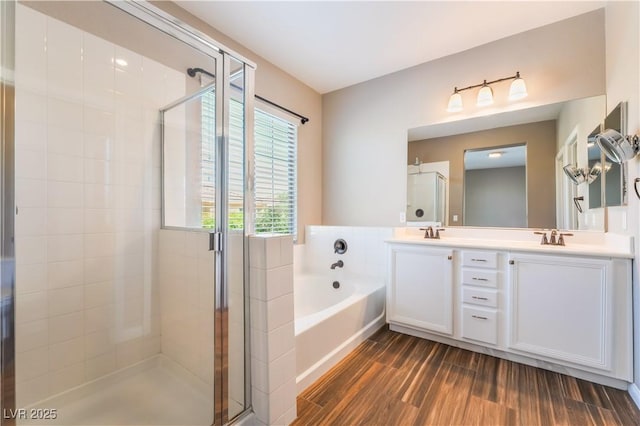 11901 Luna Del Mar Ln, Las Vegas, NV 89138 - full bath featuring a stall shower, a garden tub, wood finished floors, and double vanity
