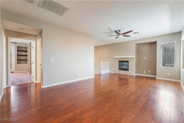 11901 Luna Del Mar Ln, Las Vegas, NV 89138 - unfurnished living room with a ceiling fan, wood finished floors, and a glass covered fireplace