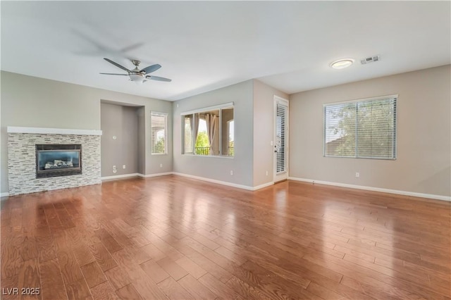 11901 Luna Del Mar Ln, Las Vegas, NV 89138 - unfurnished living room featuring plenty of natural light, ceiling fan, and wood finished floors