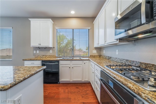 11901 Luna Del Mar Ln, Las Vegas, NV 89138 - kitchen with appliances with stainless steel finishes, recessed lighting, white cabinets, light stone countertops, and dark wood-style floors