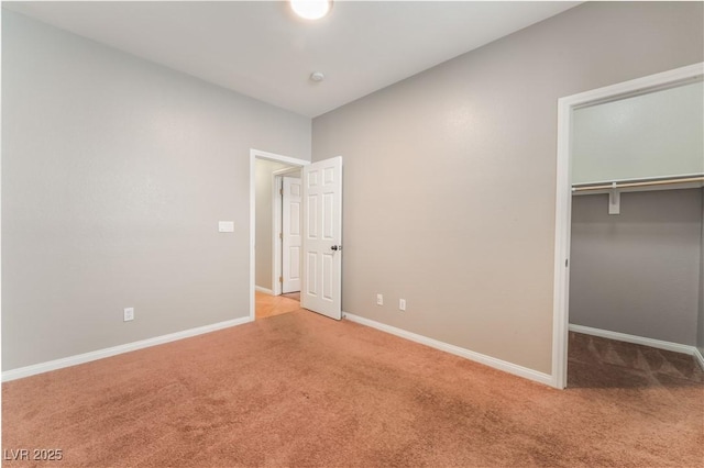 11901 Luna Del Mar Ln, Las Vegas, NV 89138 - unfurnished bedroom featuring carpet flooring, a walk in closet, and a closet