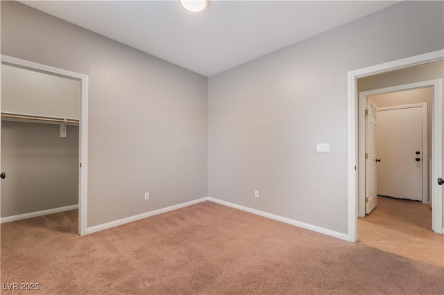 11901 Luna Del Mar Ln, Las Vegas, NV 89138 - unfurnished bedroom featuring light carpet, a closet, and a walk in closet