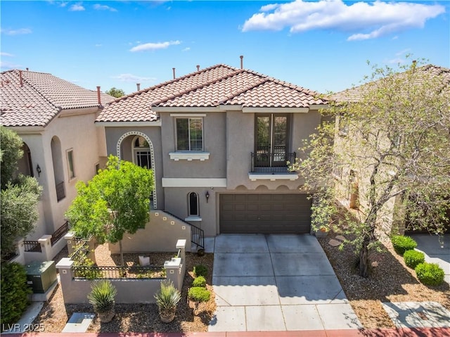 11901 Luna Del Mar Ln, Las Vegas, NV 89138 - mediterranean / spanish-style house with stucco siding, a tiled roof, a fenced front yard, driveway, and a garage