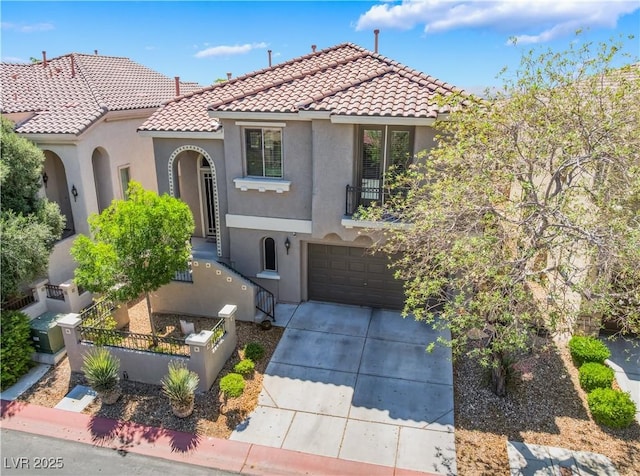 11901 Luna Del Mar Ln, Las Vegas, NV 89138 - mediterranean / spanish home with a tiled roof, stucco siding, driveway, a fenced front yard, and a garage