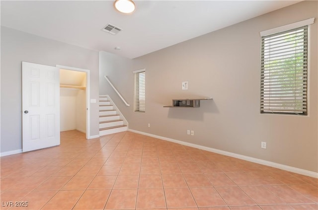 11901 Luna Del Mar Ln, Las Vegas, NV 89138 - unfurnished living room featuring light tile patterned floors and stairs