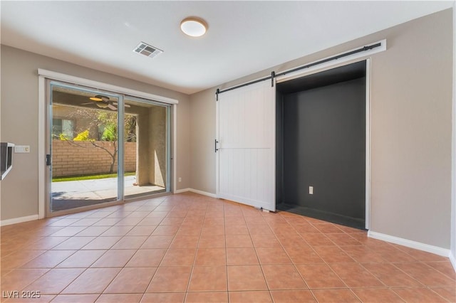 11901 Luna Del Mar Ln, Las Vegas, NV 89138 - unfurnished bedroom with access to outside, a barn door, and light tile patterned floors
