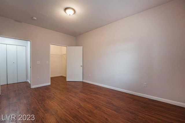 5415 W Harmon Ave Unit 1162, Las Vegas, NV 89103 - unfurnished bedroom with wood finished floors, a walk in closet, and a closet