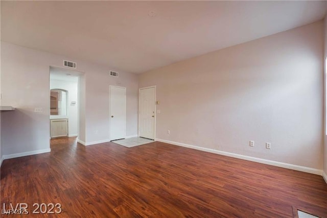 5415 W Harmon Ave Unit 1162, Las Vegas, NV 89103 - spare room featuring wood finished floors and baseboards