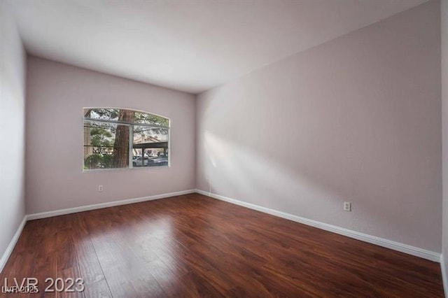 5415 W Harmon Ave Unit 1162, Las Vegas, NV 89103 - empty room featuring wood finished floors and baseboards