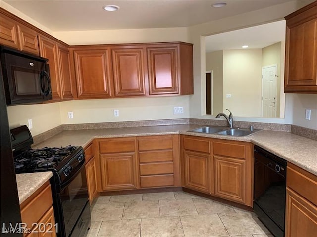 3813 Juanita May Ave, North Las Vegas, NV 89032 - kitchen featuring black appliances, recessed lighting, and brown cabinetry