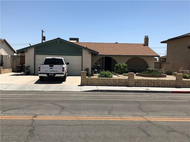 308 Sunbeam Dr, Las Vegas, NV 89107 - ranch-style house featuring concrete driveway, a garage, and stucco siding