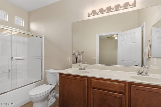 6413 White Tiger Ct, Las Vegas, NV 89130 - full bath featuring double vanity, combined bath / shower with glass door, and a ceiling fan