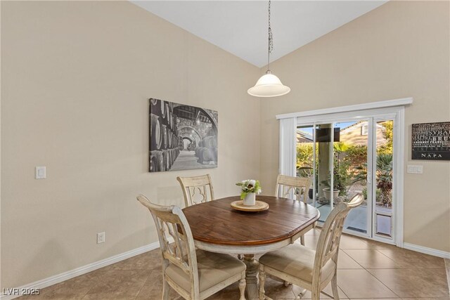 6413 White Tiger Ct, Las Vegas, NV 89130 - dining area with high vaulted ceiling and light tile patterned floors