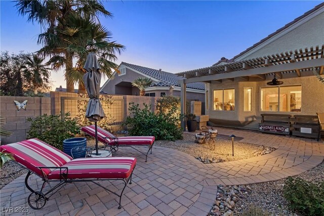 6413 White Tiger Ct, Las Vegas, NV 89130 - patio terrace at dusk featuring a patio and area for grilling