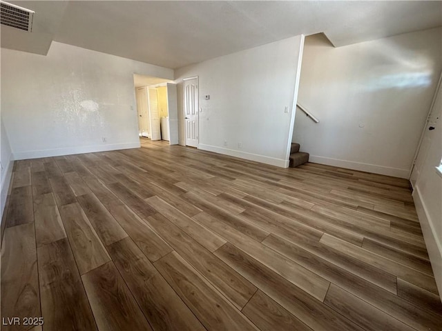 453 Las Casitas Way, Las Vegas, NV 89121 - spare room featuring wood finished floors and stairway