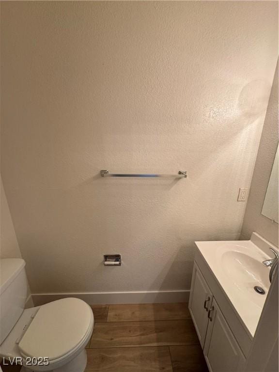 453 Las Casitas Way, Las Vegas, NV 89121 - half bathroom featuring vanity and wood finished floors