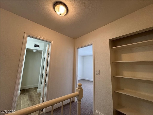 453 Las Casitas Way, Las Vegas, NV 89121 - corridor with a textured wall, a textured ceiling, and wood finished floors
