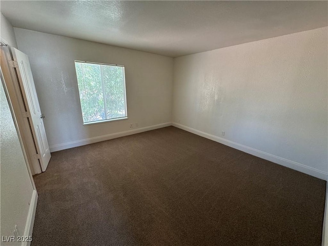 453 Las Casitas Way, Las Vegas, NV 89121 - empty room featuring dark carpet and baseboards