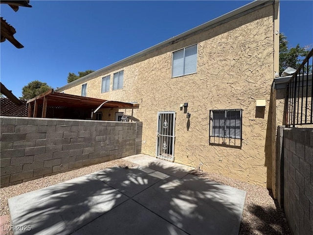 453 Las Casitas Way, Las Vegas, NV 89121 - rear view of property featuring stucco siding and a patio