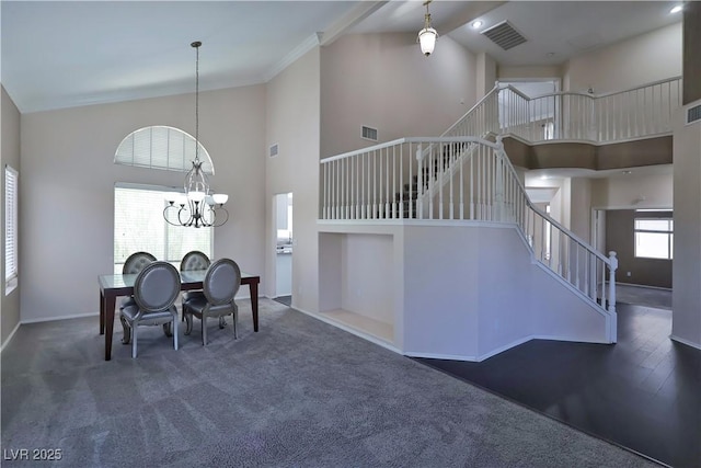 975 Leadville Meadows Dr, Henderson, NV 89052 - dining area with high vaulted ceiling, stairway, a chandelier, and carpet